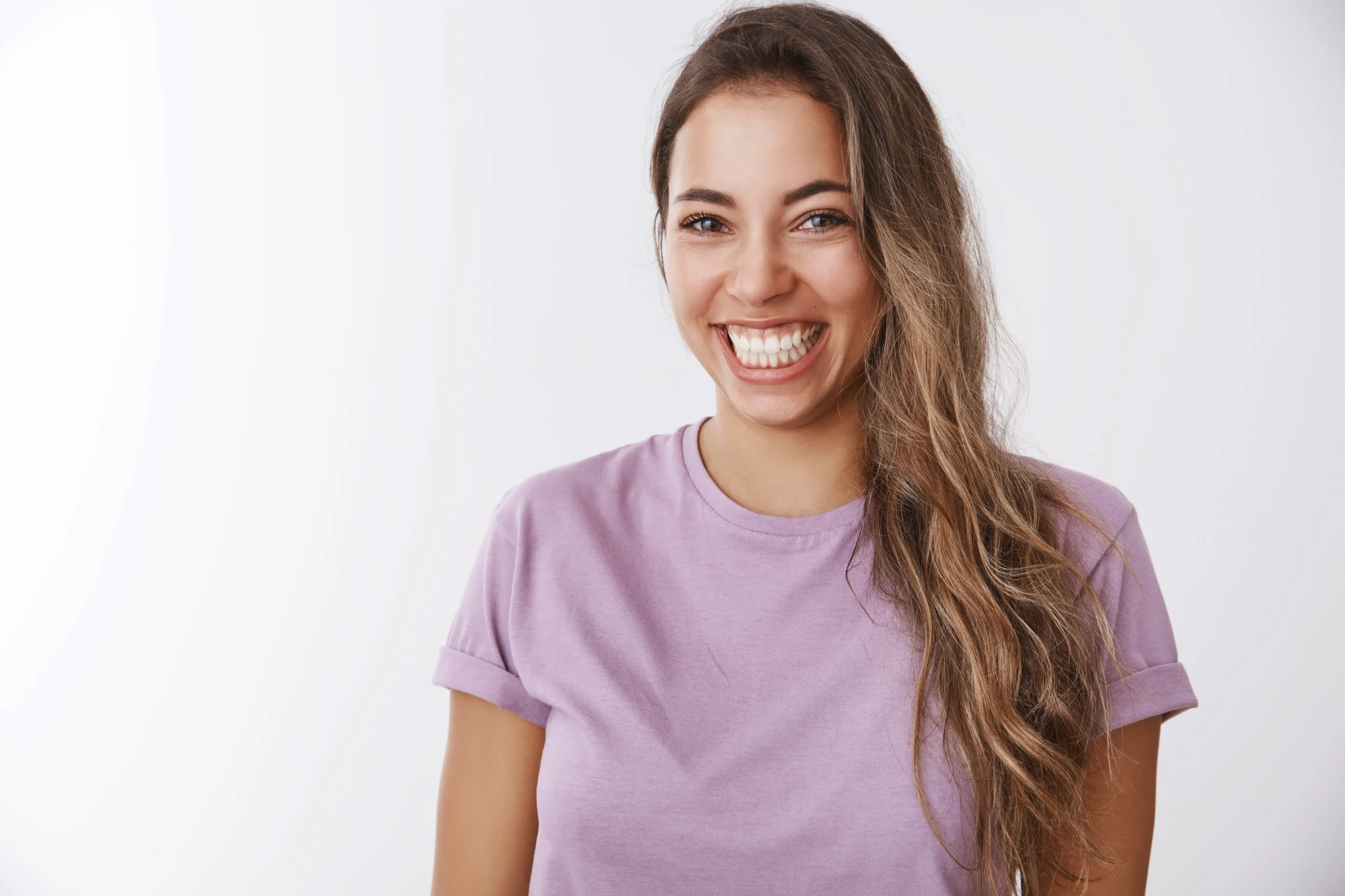 Smiling woman with healthy white teeth, representing the results of using ProvaDent for radiant oral health.